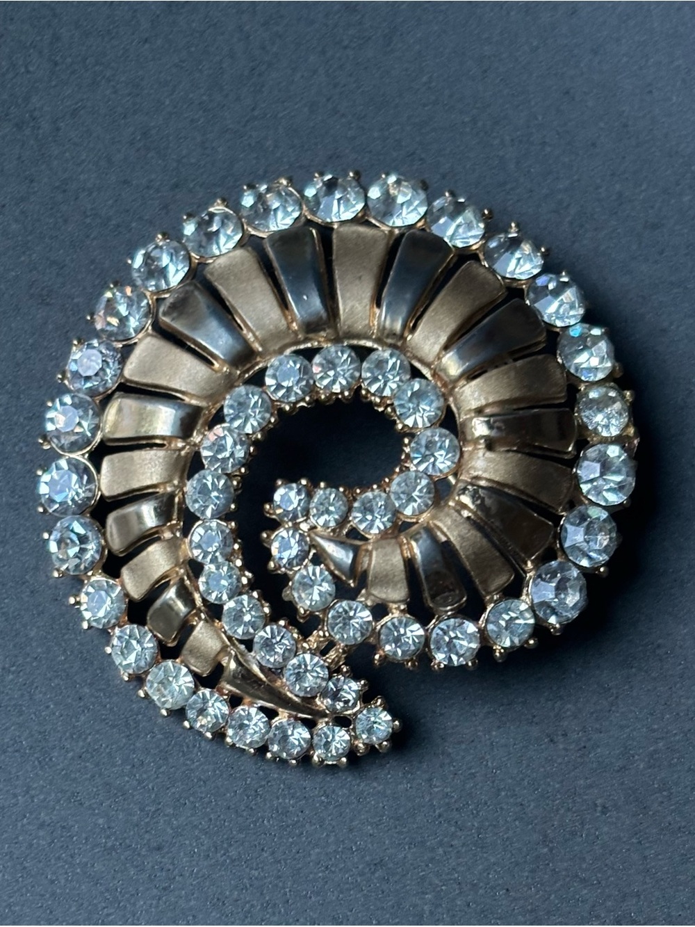 Crown-Trifari fossil shaped Gold-Tone Spiral Crystal Brooch,clear rhinestones.